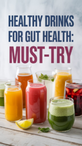 A variety of healthy drinks for gut health in clear glasses, featuring green smoothies, orange citrus juices, and a red berry blend with a lemon wedge on a wooden surface.