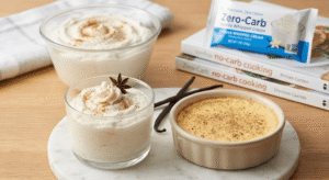 A single-serving baked custard in a ceramic ramekin alongside elegant glass cups filled with cinnamon-dusted whipped ricotta and whipped cream.